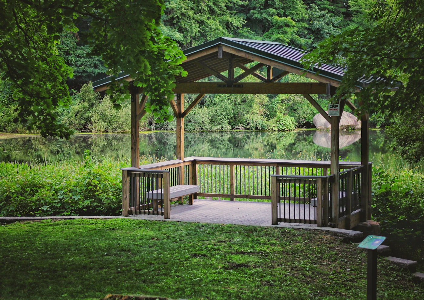 Outdoor timber gazebo with fresh coating